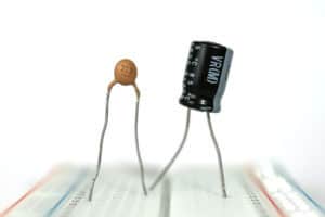 Two capacitors on a breadboard